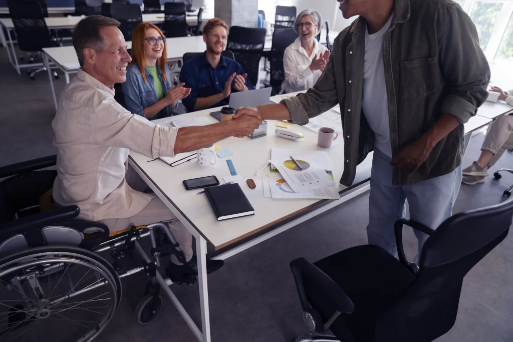 man wheelchair having inclusive office job